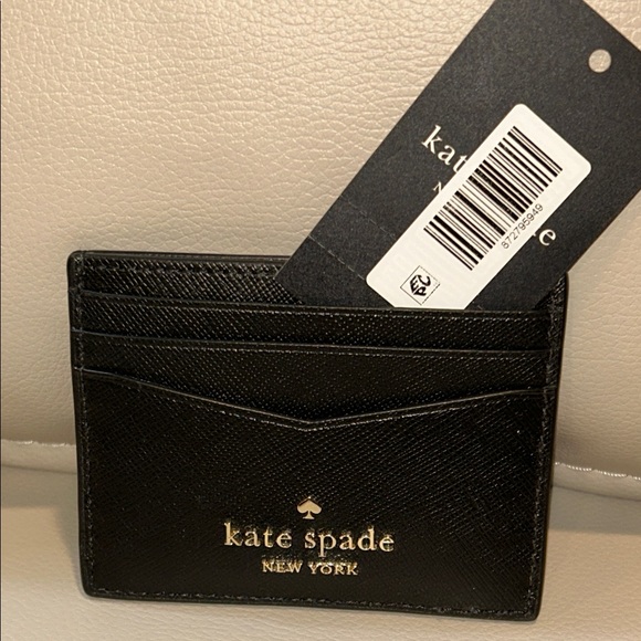kate spade Handbags - kate spade black and gold cardholder